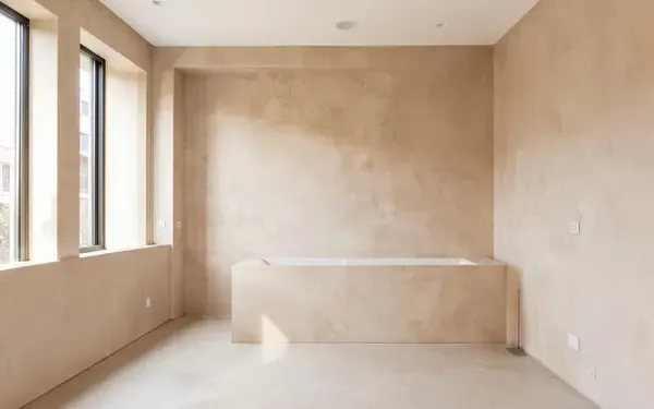 Interior with seamless hand-applied decorative plaster wall and floor finishes